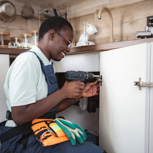 handyman-repairing-kitchen-cabinet-using-cordless-2025-10-27-05-13-17-utc